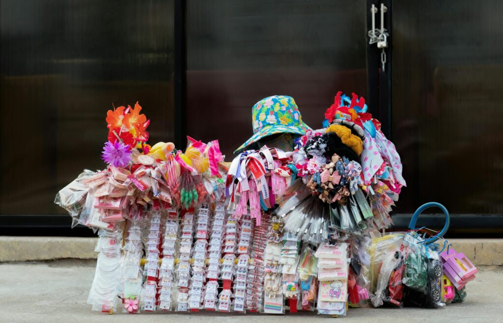 A vendor rests on the sidewalk.