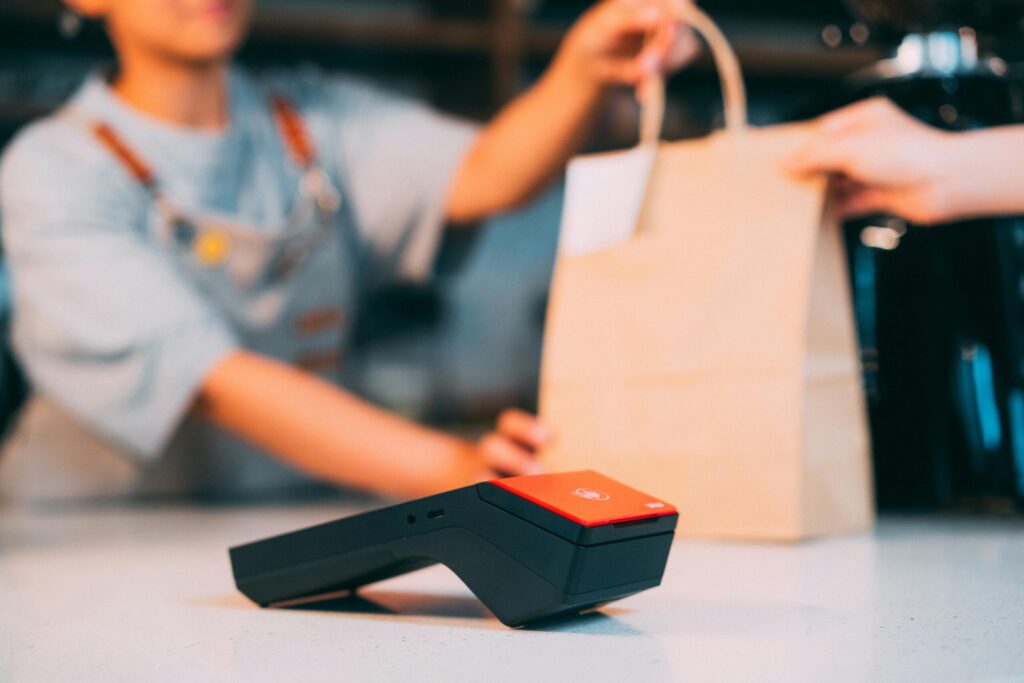 Good credit means more shopping. A store clerk hands out a purchase through the buy-now-pay-later app Mocasa.