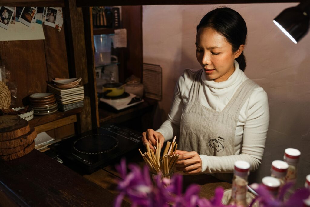A shop owner fixes her stocks before opening