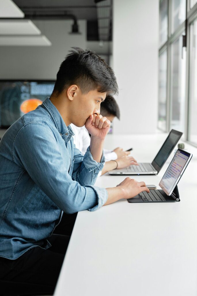 A young professional browses the internet for his car options. Is he eligible for a loan? Credit Kaagapay can help.