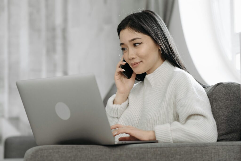 A woman makes a call regarding a credit card application.