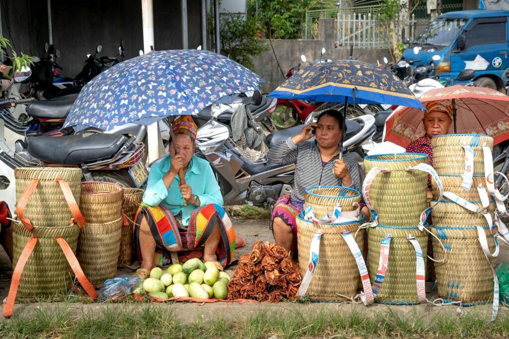 Women selling on the sidewalks.