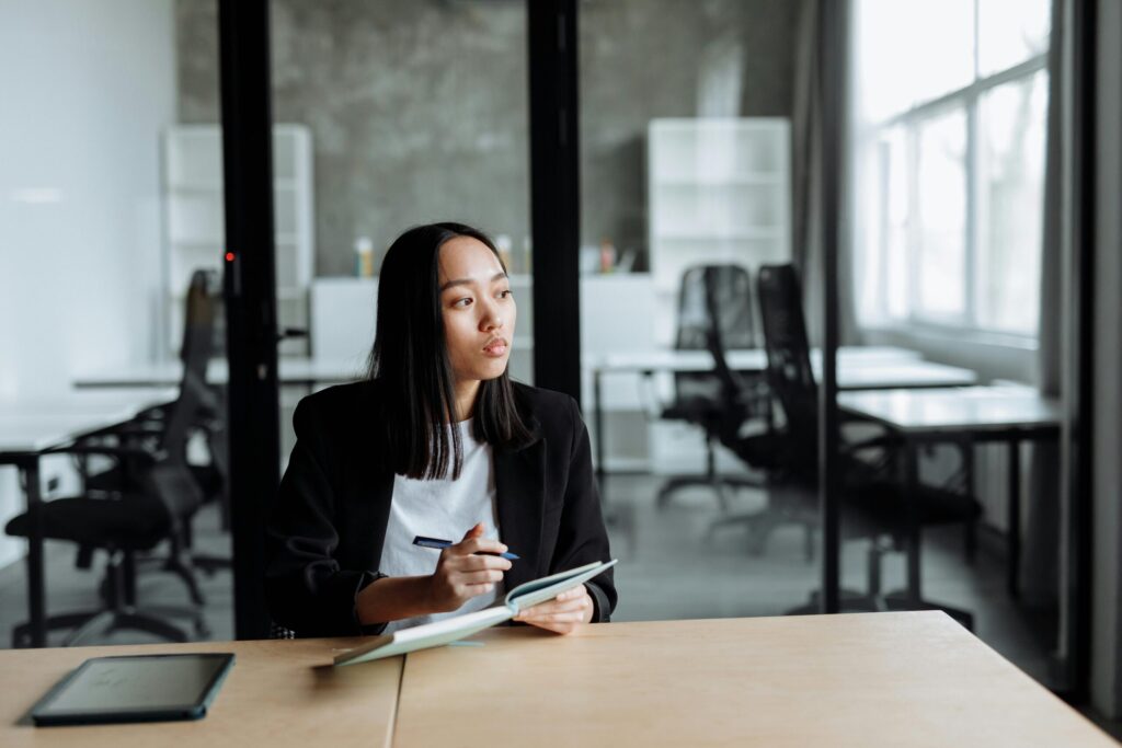 Girl pondering her future and how she could improve her credit score. Download the Credit Kaagapay app for your free credit score.